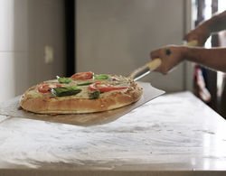 Pizza on a wooden peel ready for the oven