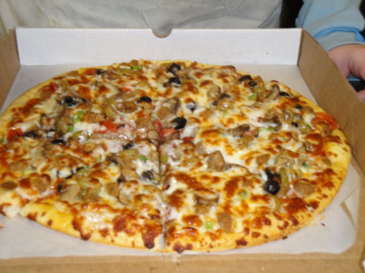 Combination supreme pizza in a takeout box at Joe's Pizza, Woodville AL